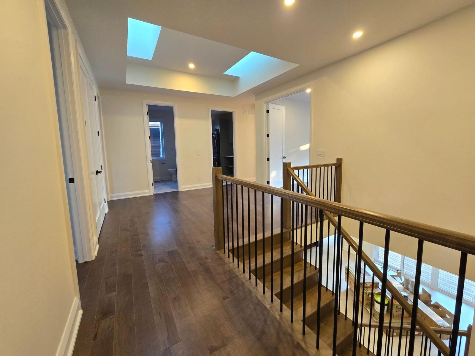 Light-filled landing and detailed millwork at the Alta Vista residence